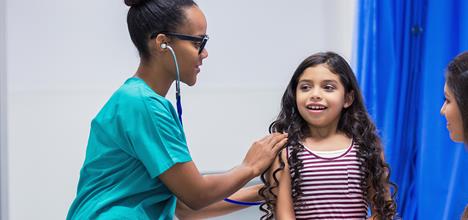 Hispanic girl in doctor's office.