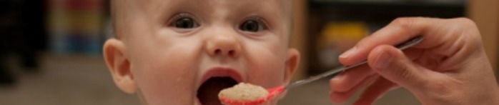 a baby eating a cupcake