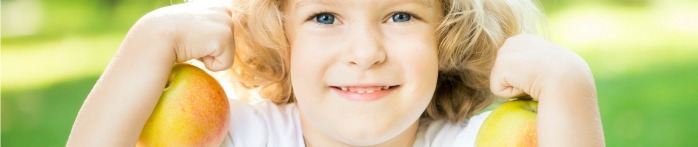 a child holding an apple